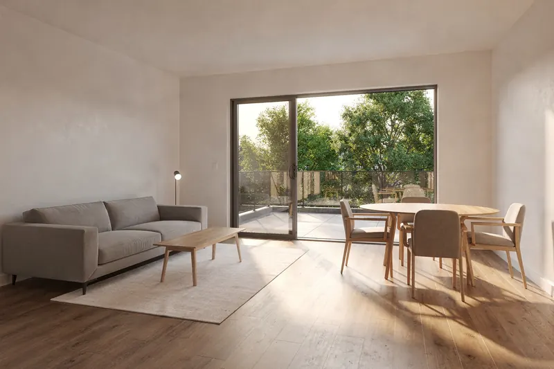 Open great room and dining area with sliding door to a terrace